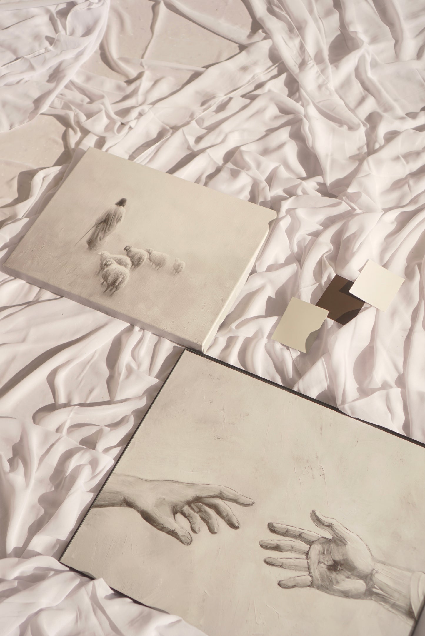 Two drawings of hands reaching towards each other on a textured white surface. Gentle Shepherd B&W Canvas Christian wall art modern, Jesus the Shepherd, devotion-inspired.