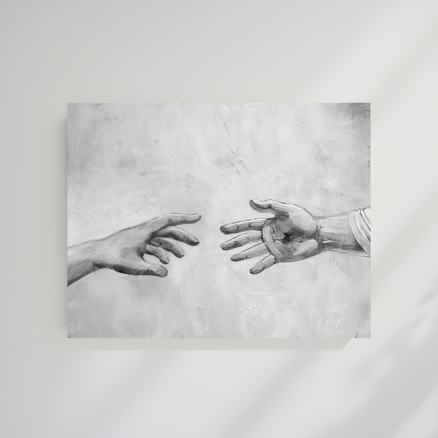 Artistic depiction of two hands reaching towards each other on a textured gray background. Reaching Out B&W Christian wall art modern of Jesus’ hand, black and white faith artwork.