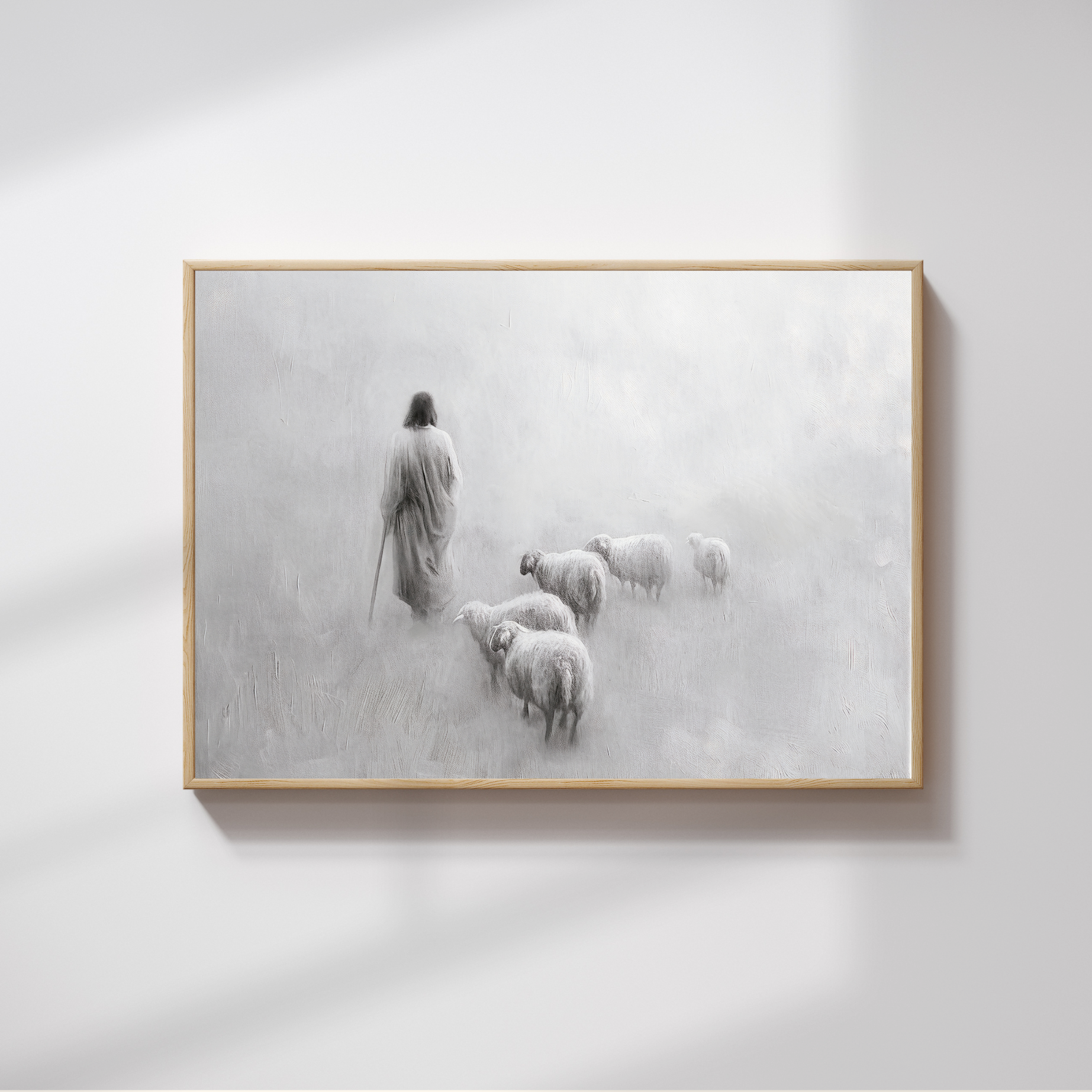 Framed artwork of a shepherd with sheep on a misty background.  Gentle Shepherd B&W Christian art modern, Jesus’ compassion, black and white wall print.