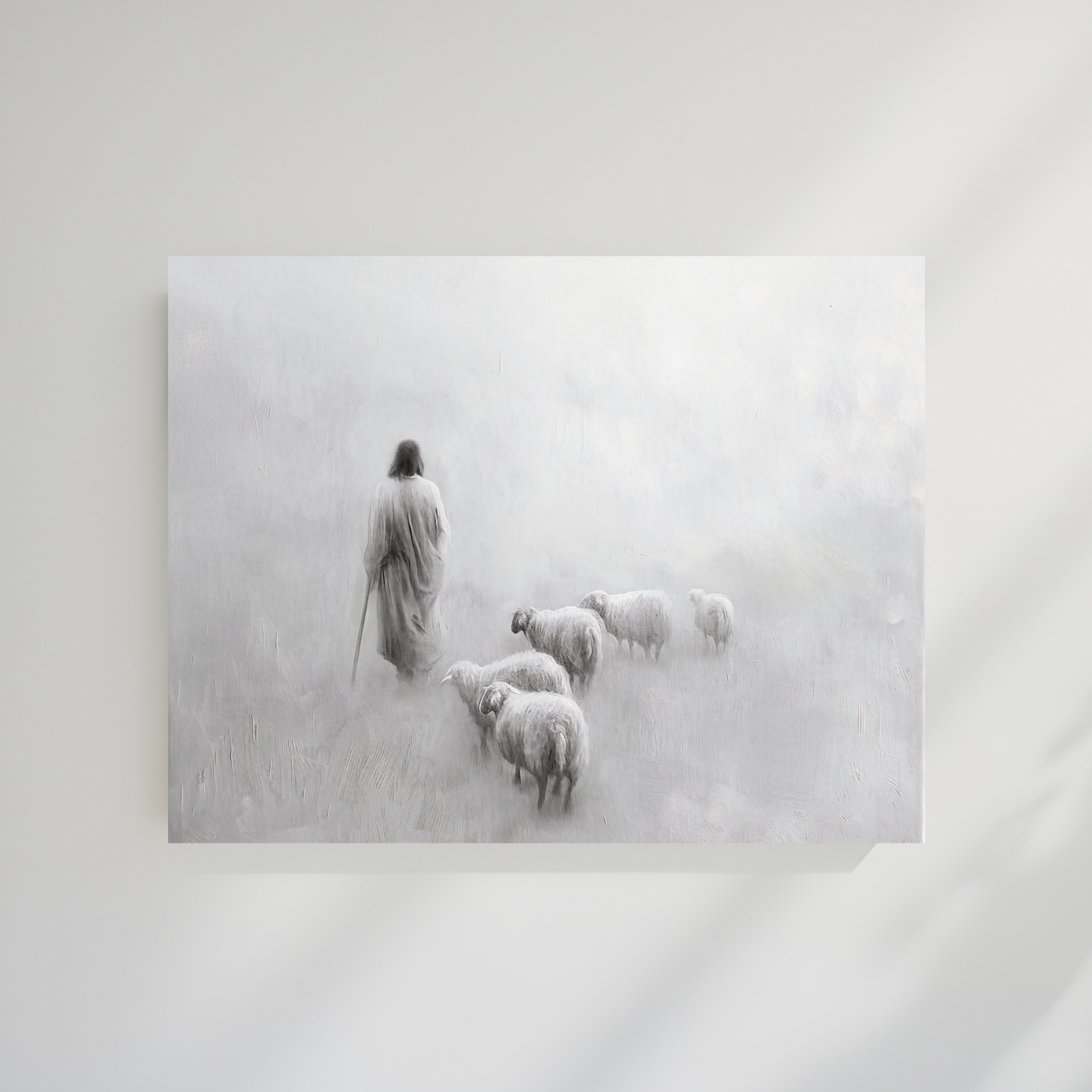 Framed black and white artwork of a shepherd with sheep in a snowy landscape. Gentle Shepherd B&W Christian art modern, Jesus’ compassion, black and white wall print.