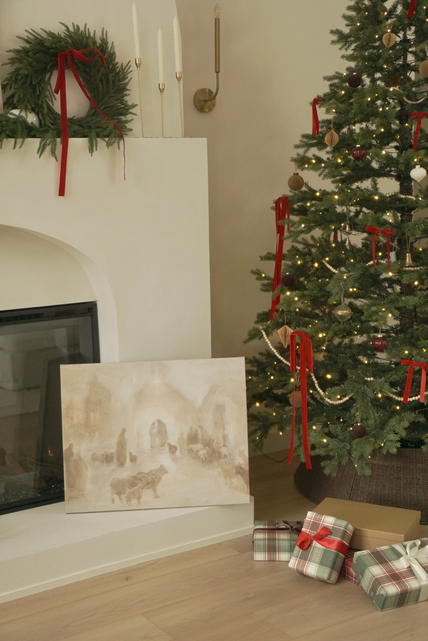 Decorated Christmas tree with presents and wreath by a fireplace.Canvas print of a historical scene in front of a decorated Christmas tree. Christian Christmas artwork made by a christian artist. Nativity scene artwork.