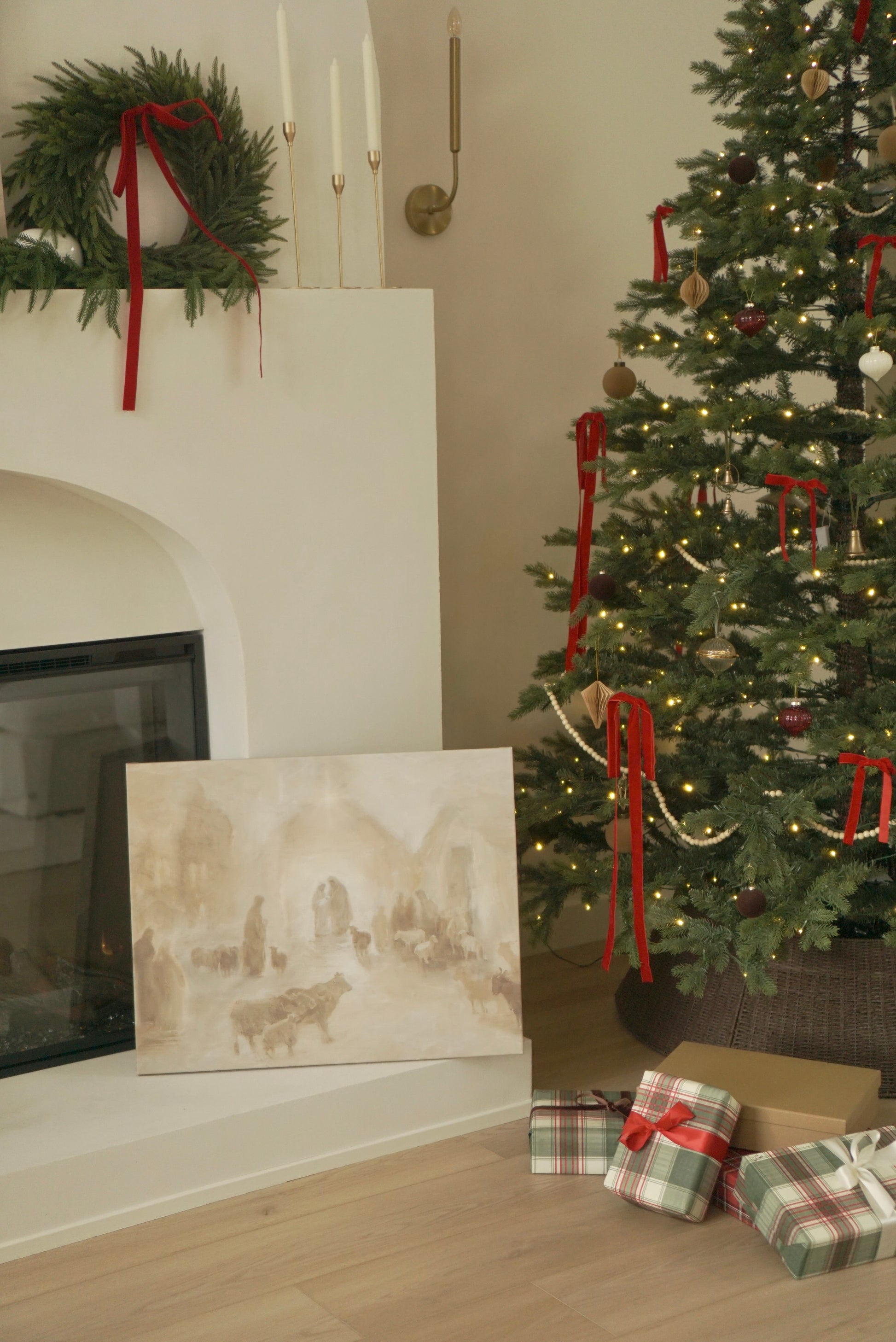 Decorated Christmas tree with presents and wreath by a fireplace.Canvas print of a historical scene in front of a decorated Christmas tree. Christian Christmas artwork made by a christian artist. Nativity scene artwork.