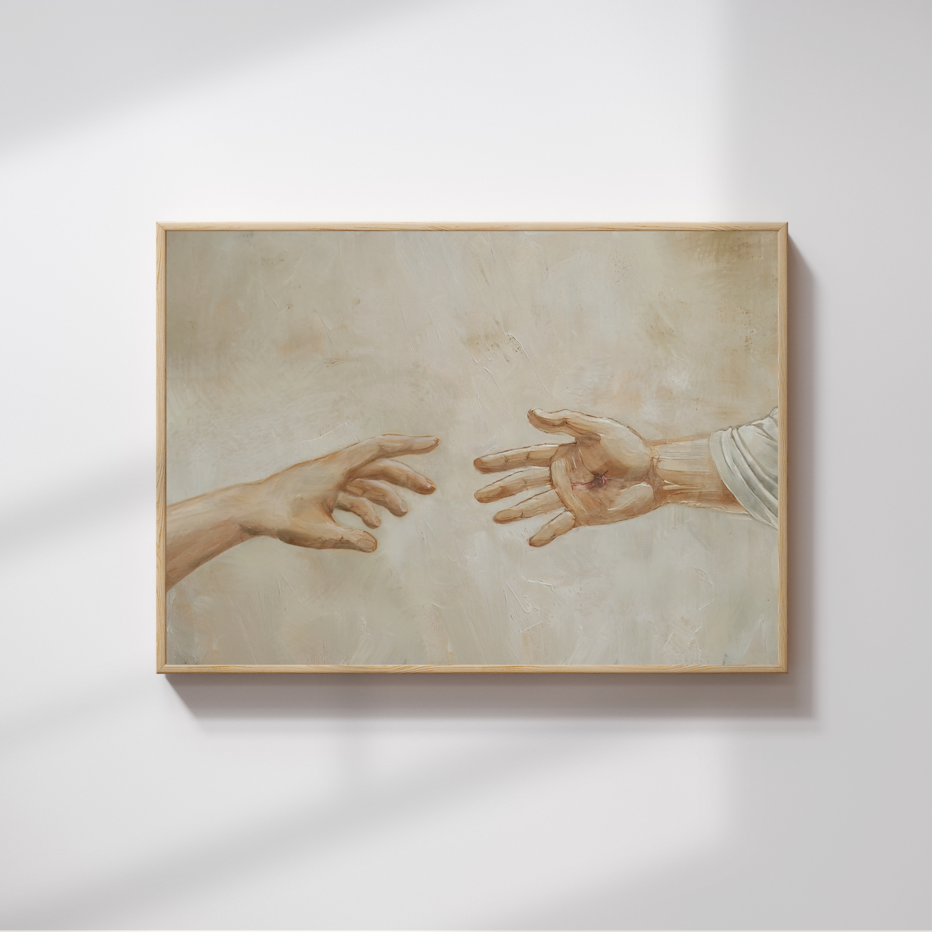 Framed artwork of two hands reaching towards each other on a light gray background, Reaching Out Canvas modern Christian wall art showing Jesus’ healing, by Christian artist.