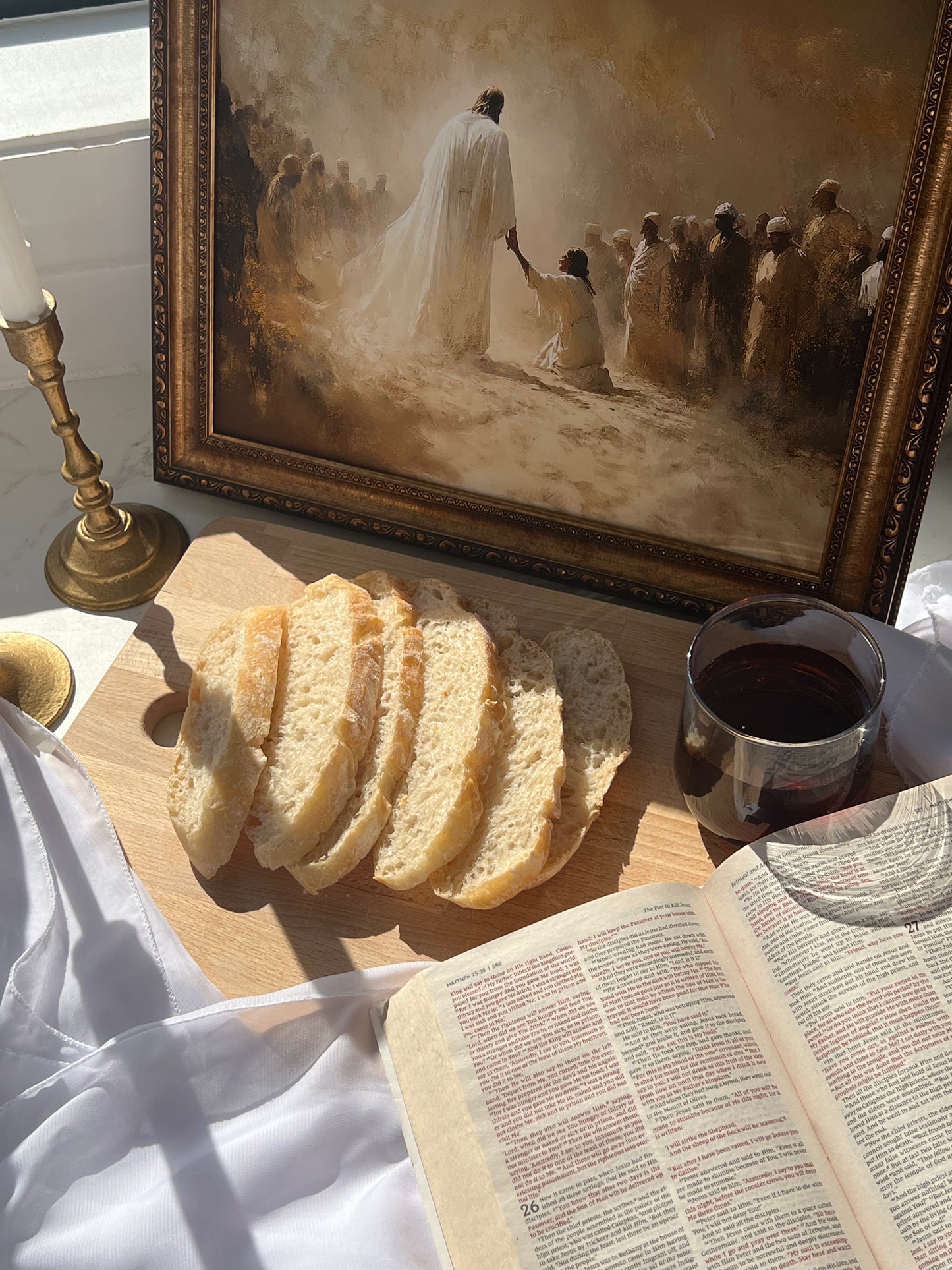 Just One Touch Print modern Christian wall art of Jesus’ healing power, faith-filled art. Framed artwork of a religious scene with bread, wine, and a Bible on a table.