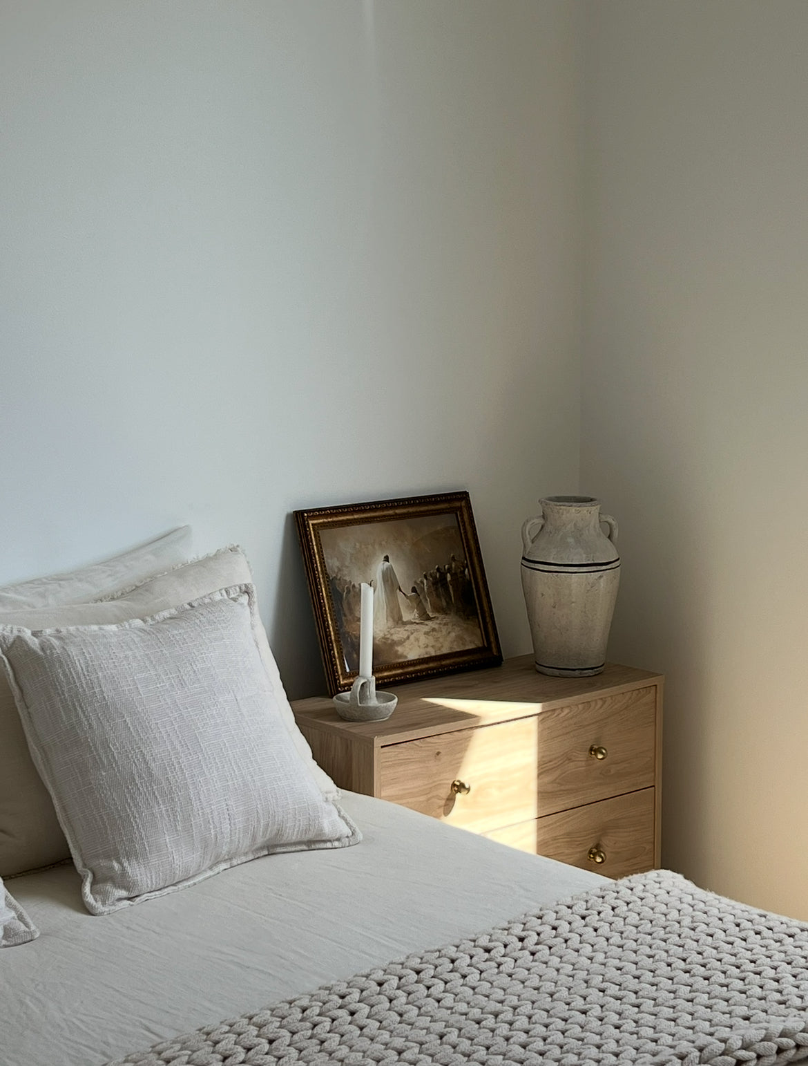 Just One Touch Print modern Christian wall art of Jesus’ healing power, faith-filled art. Bedroom with a bed, nightstand, and wall art.