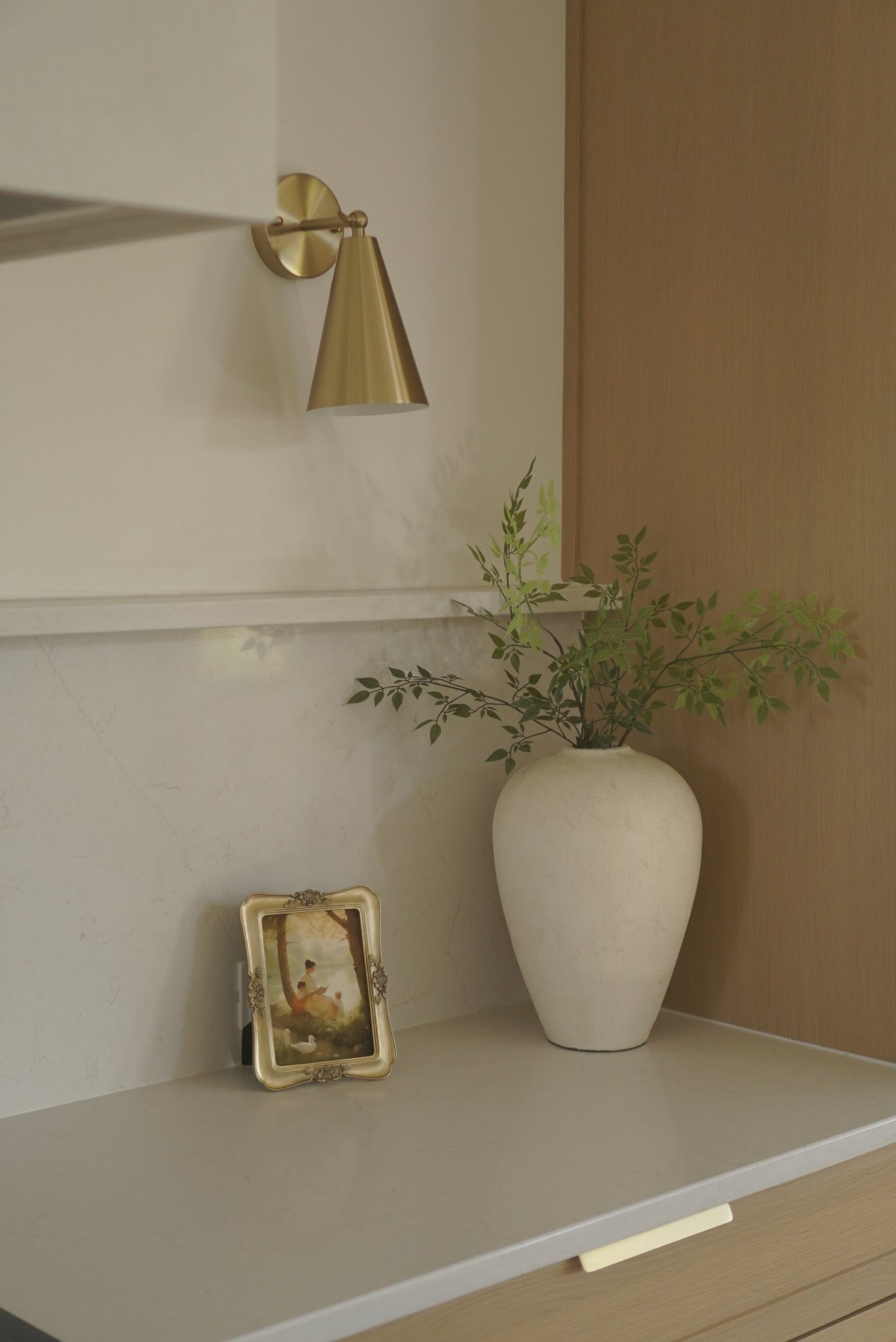 White toilet with gold fixtures in a bathroom setting. By the Pond Christian wall art modern by Christian artist capturing peace in God’s presence.