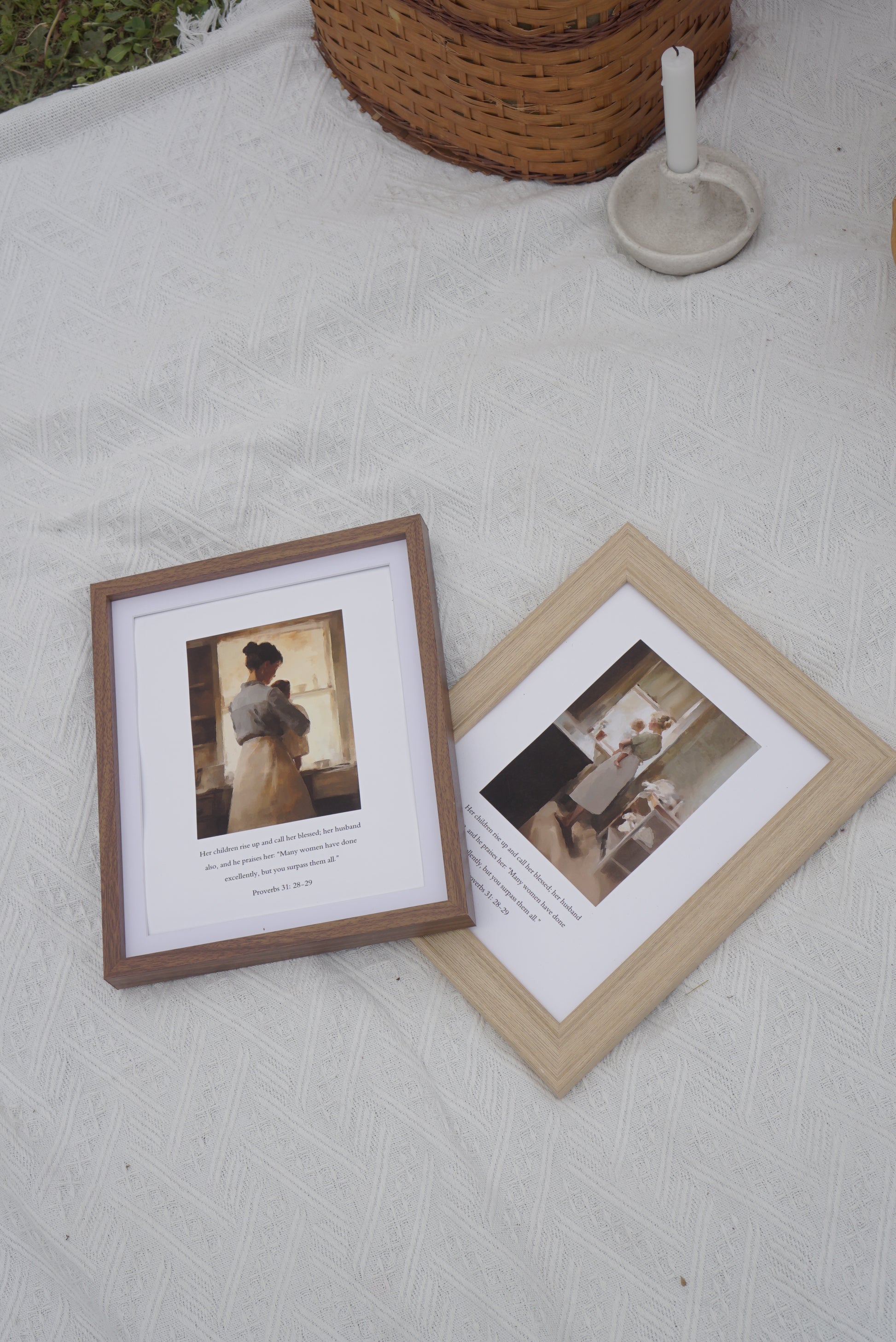 Two framed pictures on a textured surface with a woven basket in the background. Proverbs 31 V2 Scripture Print modern Christian wall art, celebrating godly strength.
